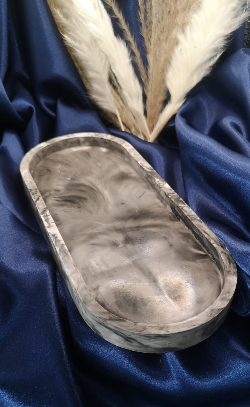 Feathered eye mask on a blue satin background