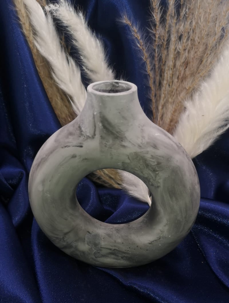 Decorative vase on a blue fabric background